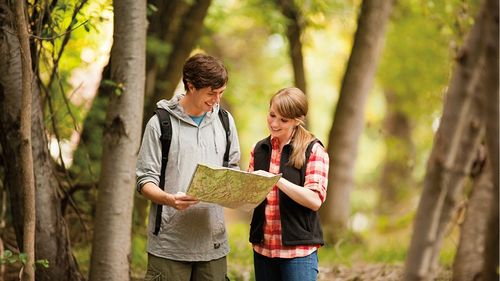 young adults looking at a map