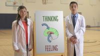 A boy and a girl stand next to a diagram of a brain with the words Thinking and Feeling written on it.