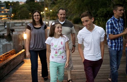 A family walking together outdoors.  Shot in Australia.