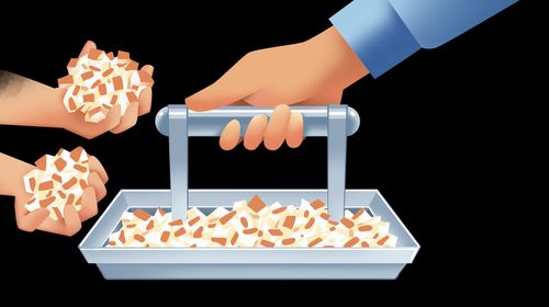 boy grabbing fistfuls of bread from tray