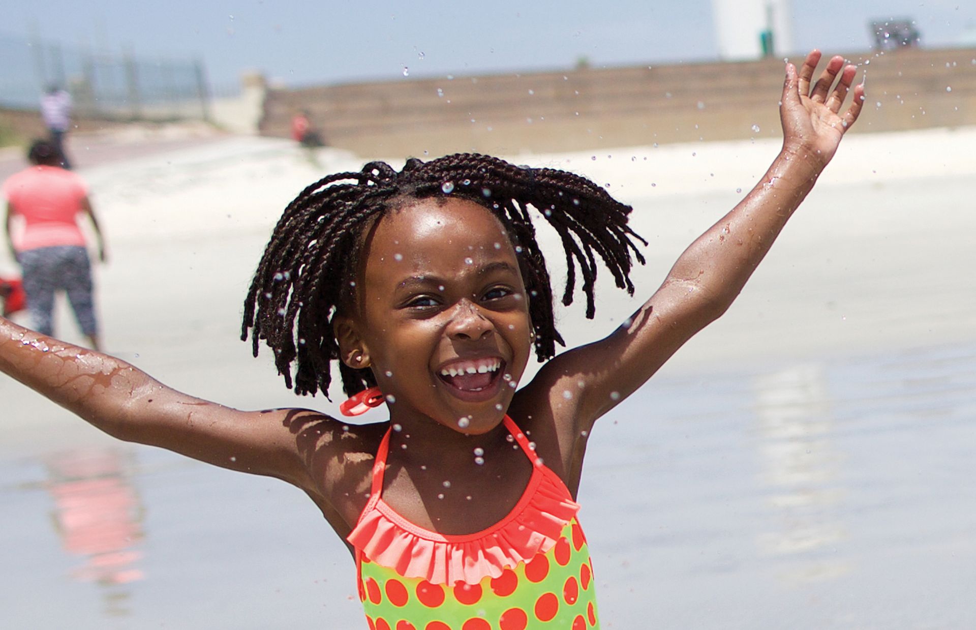 The beach is a great relief from the heat. Just ask six-year-old Tariro, who loves playing in the water.