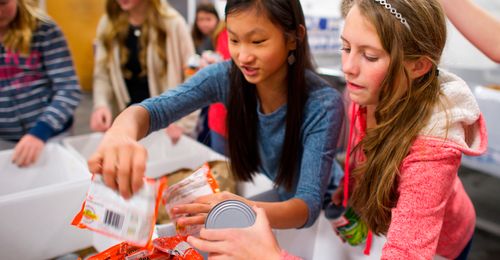 young women packing food