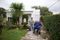 Uruguay- A man outside in a wheelchair and a woman next to him.