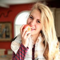 youth eating an apple