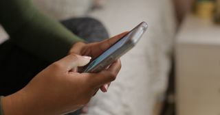 young woman holding phone