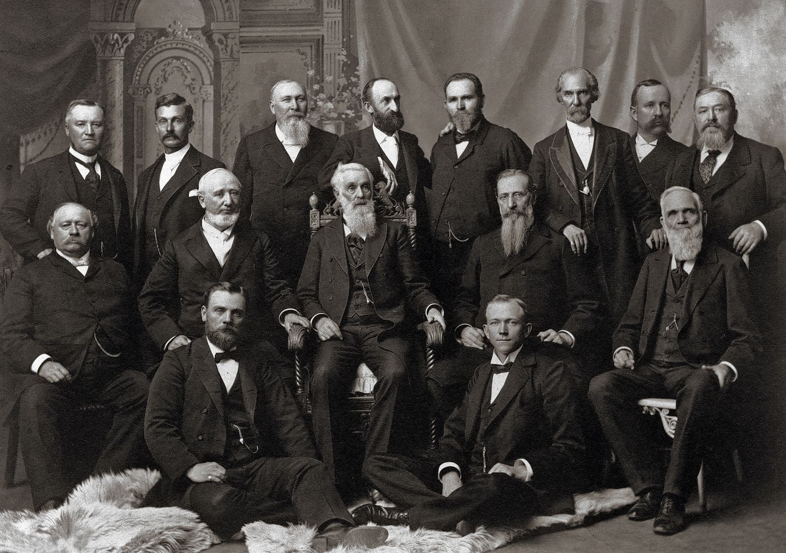 The Quorum of the Twelve Apostles in 1898. Standing, left to right: Anthon H. Lund, John W. Taylor, John Henry Smith, Heber J. Grant, Brigham Young Jr., George Teasdale, Rudger Clawson, and Marriner W. Merrill. Sitting in middle row: Francis M. Lyman, George Q. Cannon, Lorenzo Snow, Joseph F. Smith, and Franklin D. Richards. Sitting in bottom row: Matthias F. Cowley and Abraham O. Woodruff. Teachings of Presidents of the Church: Lorenzo Snow (2012), 28