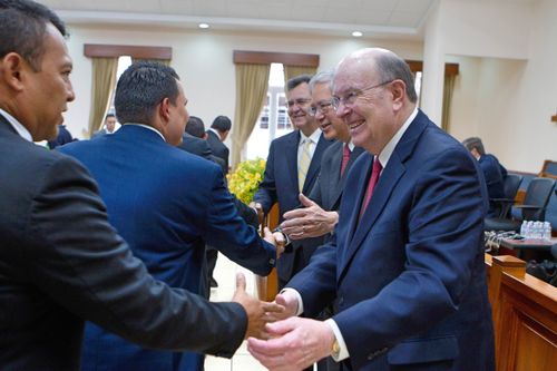 Elders Cook and Gong greeting priesthood leaders