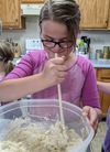 Girl stirring dough