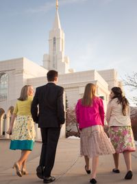 young people walking toward temple