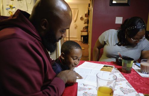 father and son reading