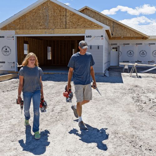 father and daughter at construction site