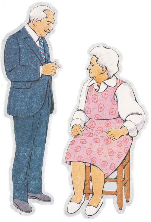 Two Primary cutouts of a grandfather with white hair and a white shirt, striped tie, and blue suit and a grandmother with white hair and a pink dress.
