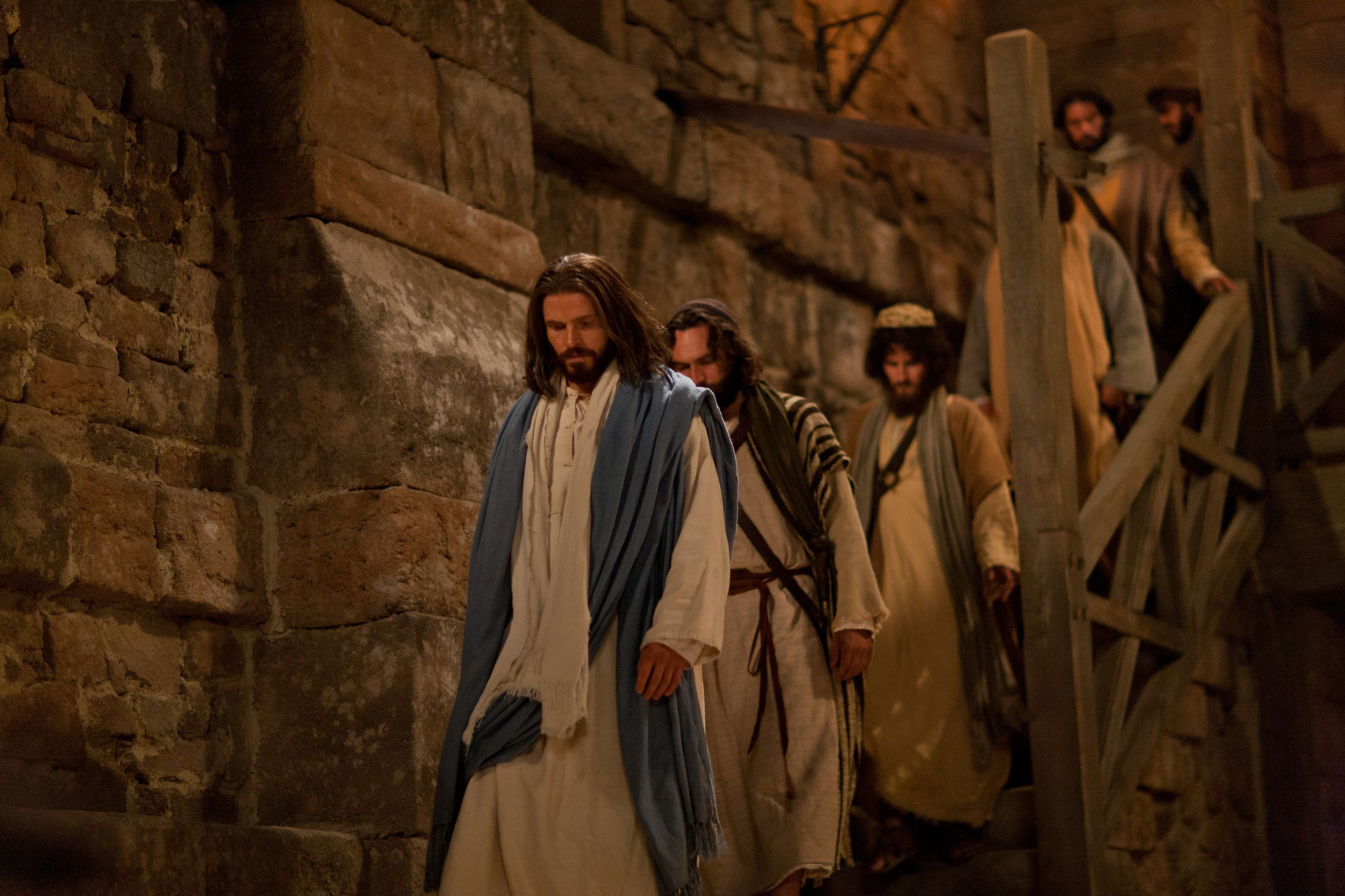 Jesus walks with the Apostles.