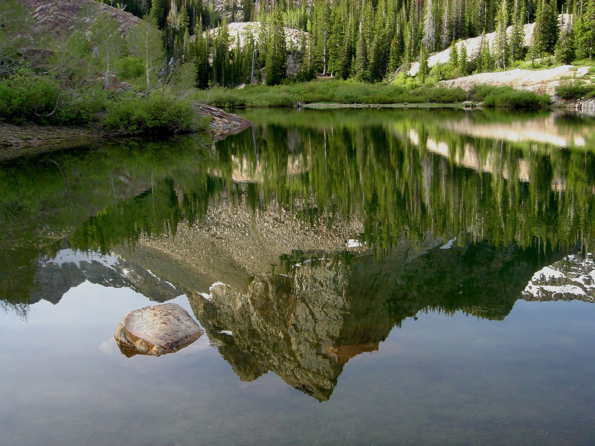 The Rocky Mountains reflected in a lake.