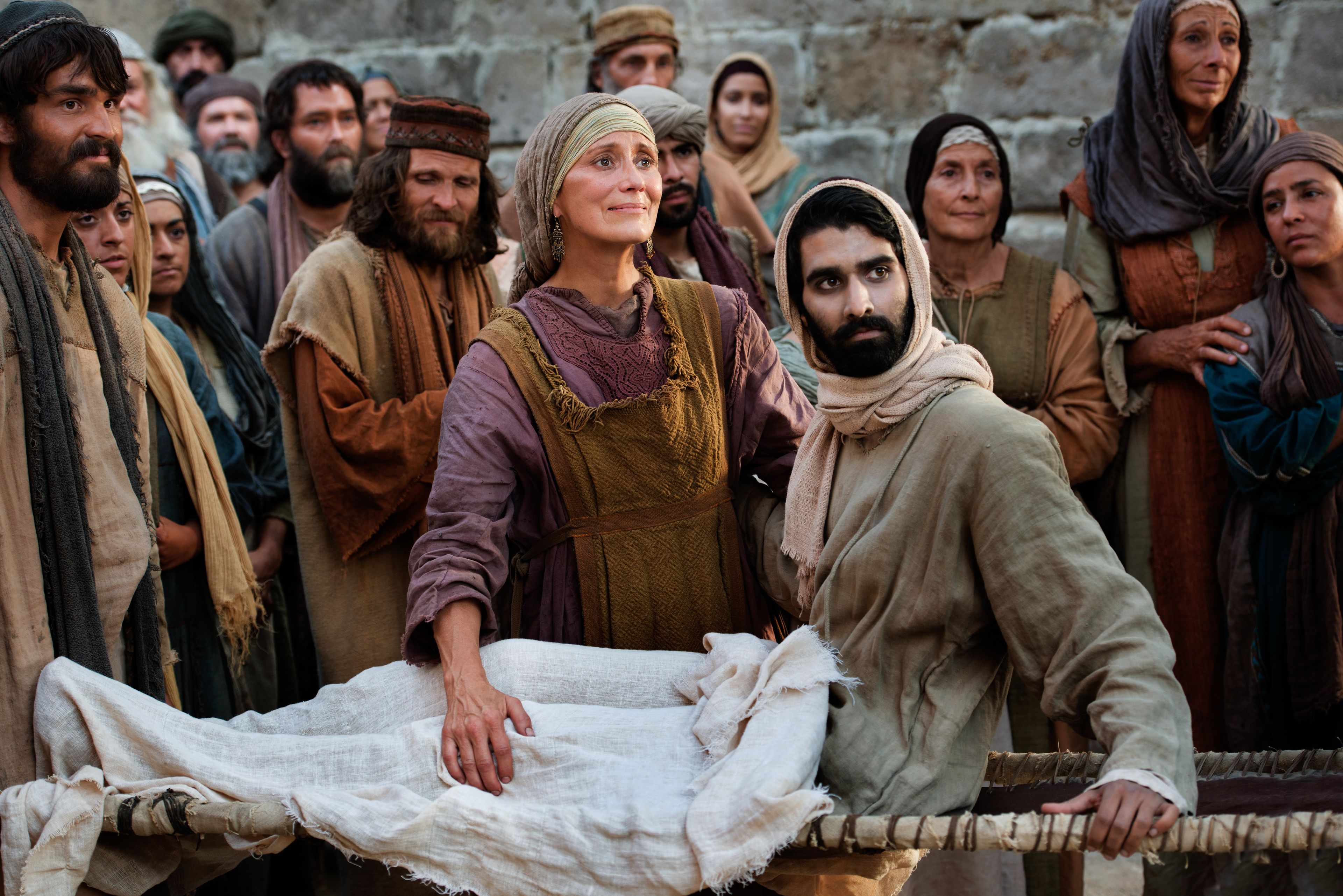 The widow of Nain looks at Jesus in gratitude after He has raised her son from the dead.