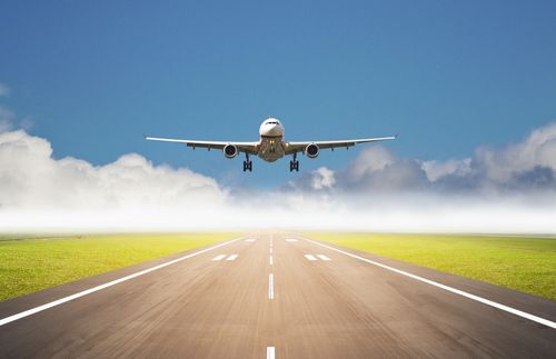 illustration of an airplane landing on a runway.