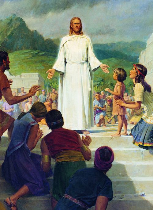 Christ in white robes stands at the top of stone steps and is surrounded by people worshipping Him. Mountains, trees and partially crumbled buildings are visible in the background. Depiction of Christ as a resurrected being appearing to the Nephites. (3 Nephi 11:10)