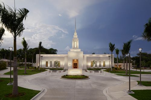 The front-facing view of the Port-au-Prince Haiti Temple with a stormy sky behind it.