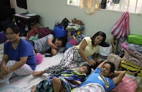 family sleeping in Church building