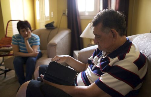 Blanca and husband reading scriptures