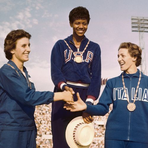 women receiving medals at Olympics