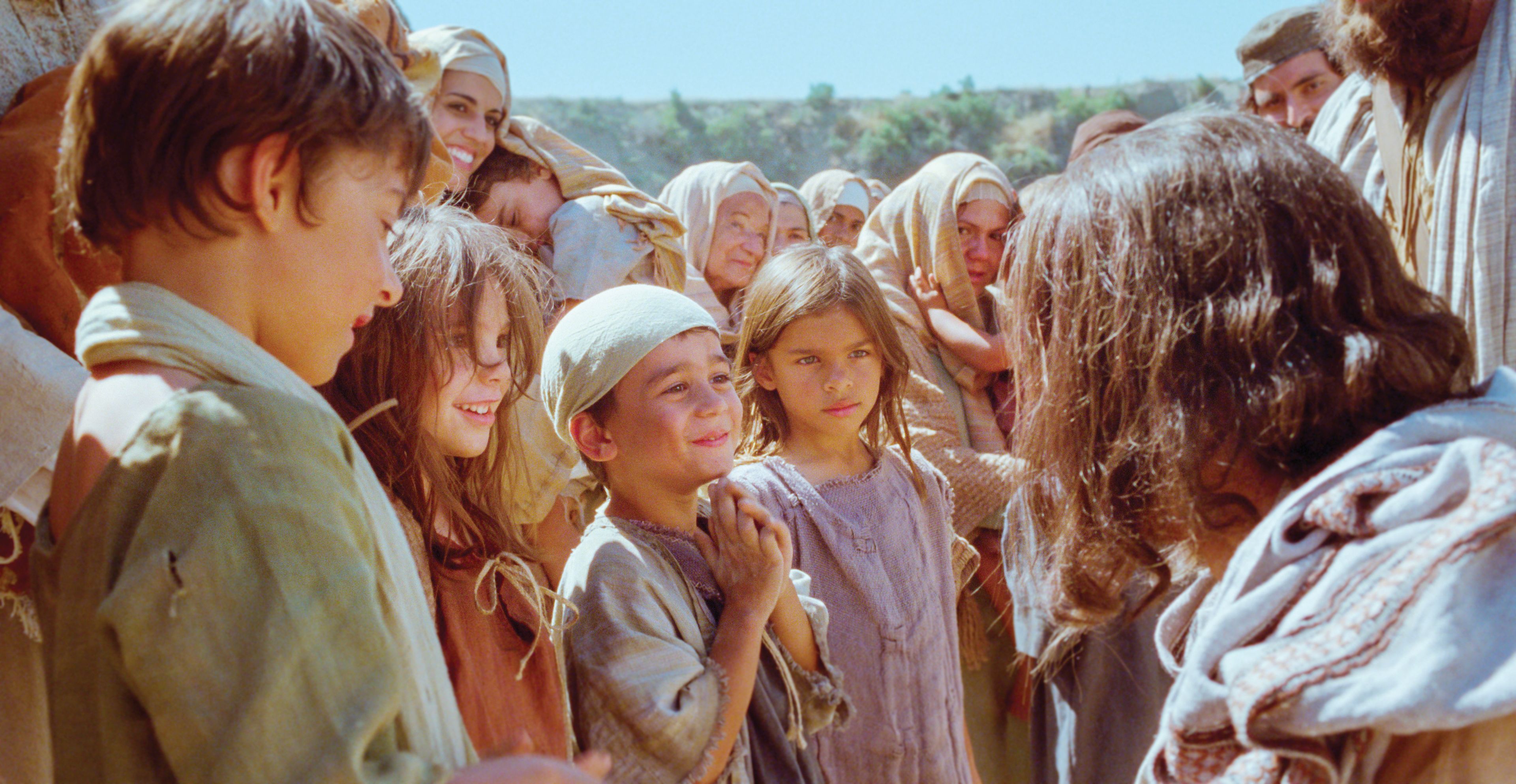 Jesus speaks with the little children.