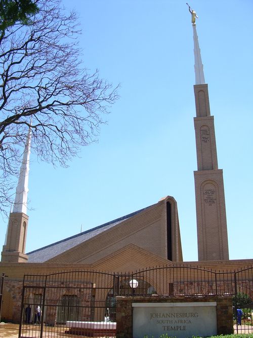 A front side view of the main spire on the Johannesburg South Africa Temple, with the temple to the side.