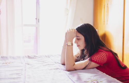 young woman praying