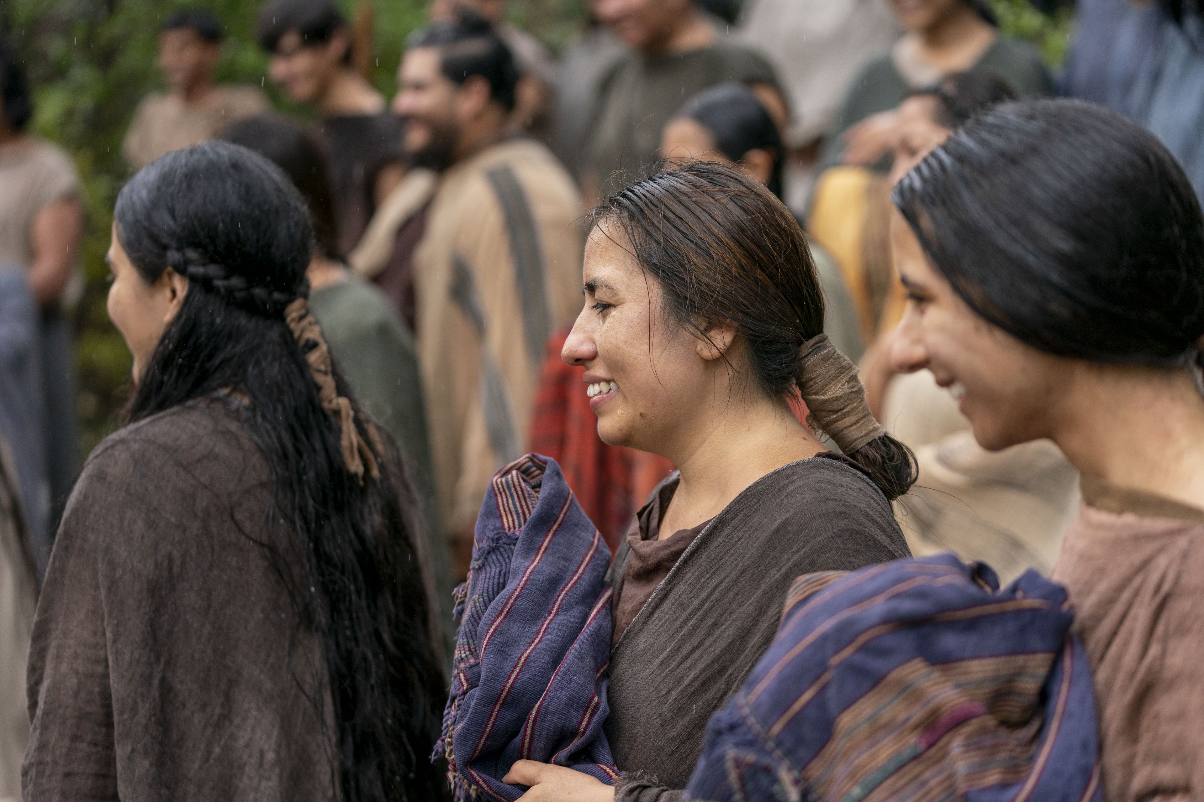 A group of people from the land of Zarahemla gather together to be baptized. They watch as Alma the Younger baptizes more of their friends and family.