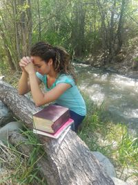 youth kneeling in prayer