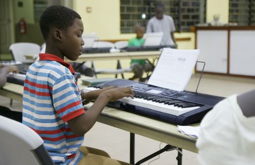young man playing keyboard