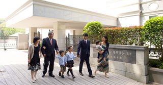 a family walks outside the temple