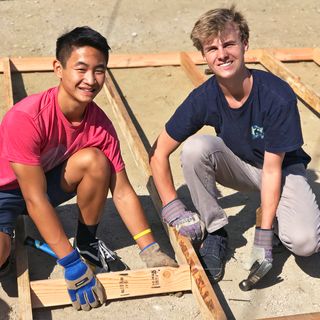 young men building house