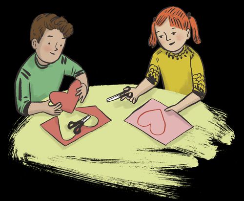 boy and girl cutting out paper hearts