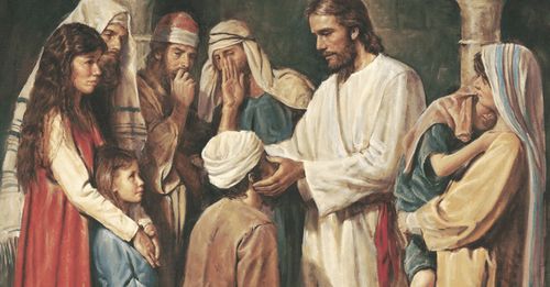 Jesus Christ standing and placing His hands on the eyes of a blind man who kneels before him. A group of men, women and children are gathered around Christ. The people are witnessing Christ heal the man of blindness. Stone arches are in the background.