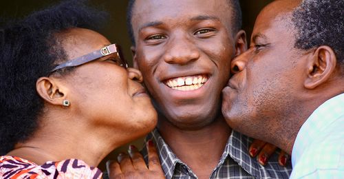 young man with parents