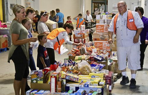 volunteers in a warehouse