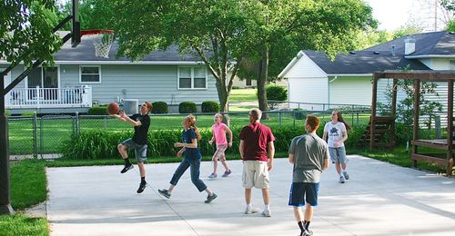 family playing basketball