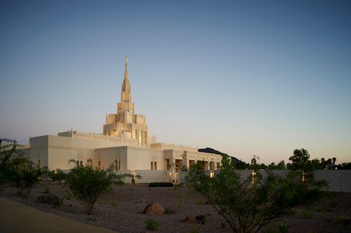 The Phoenix Arizona Temple during sunset, including scenery and a clear sky.
