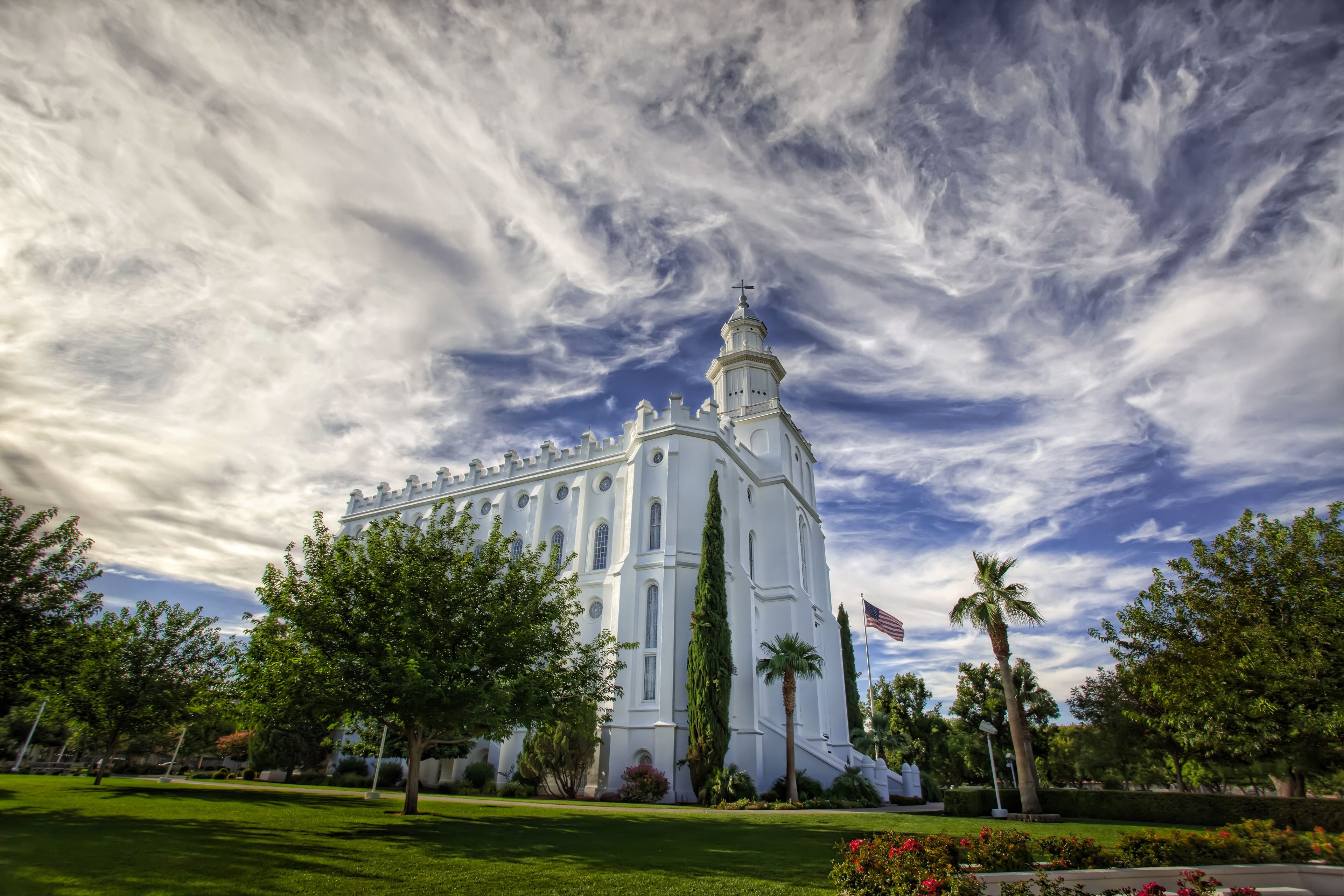 The St. George Utah Temple in daylight, including the entrance and scenery.