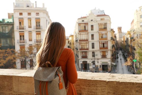 young woman enjoying cityscape in Spain