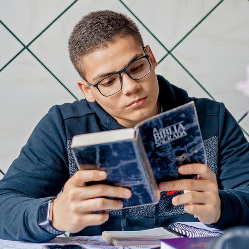 young man reading scriptures