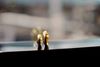 two gold rings on windowsill