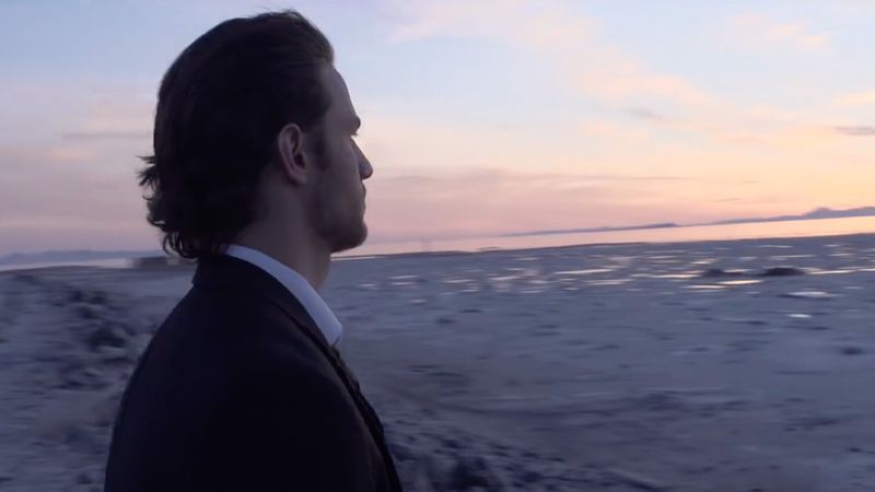 A man looks toward the horizon contemplating God’s influence in his life