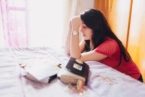 Young woman praying.