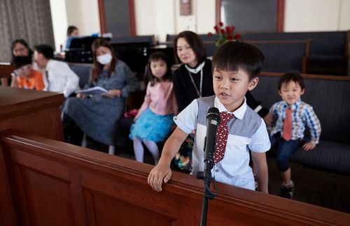 A group of primary children and teachers work on a primary program. They are practicing inside a chapel. They are in an LDS Church Building in Hong Kong.   This is part of a stock photography shoot in Cambodia and Hong Kong