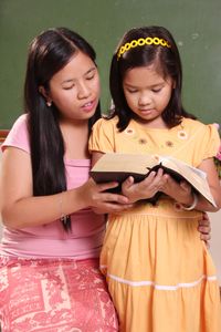 girls reading scriptures