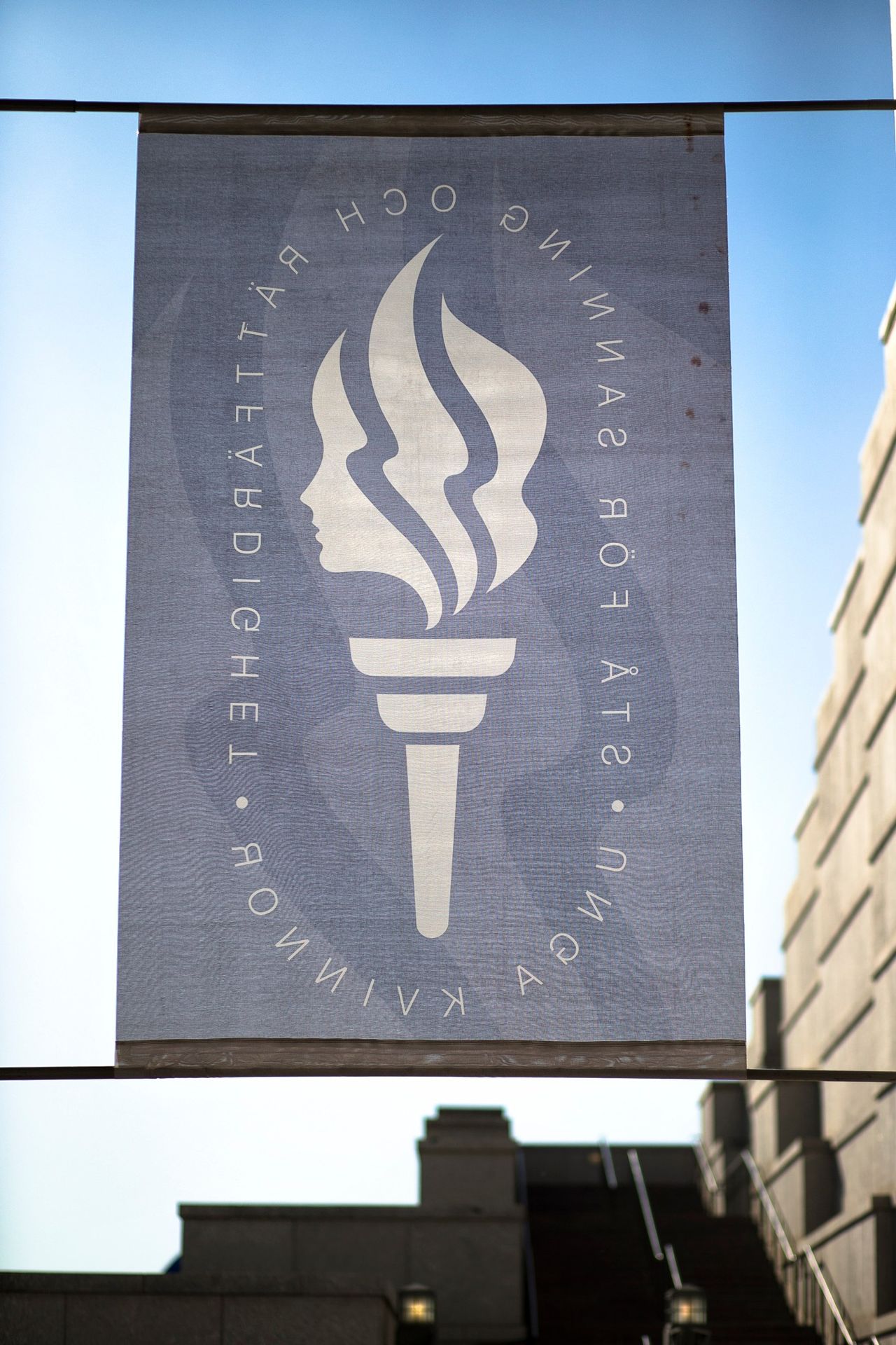 A Young Women banner hanging outside the Conference Center.  