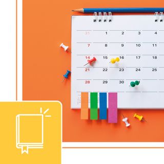 Calendar with sticky notes and push pins