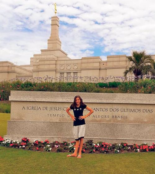 Emily Silva stands in front of the Porto Alegre Brazil Temple.